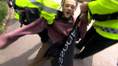 The arrest came as the prime minister arrived at a election campaign event in Wrexham.