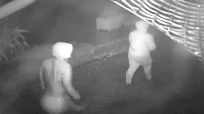 CCTV footage of two hooded men