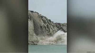 Section of cliff falling into the sea