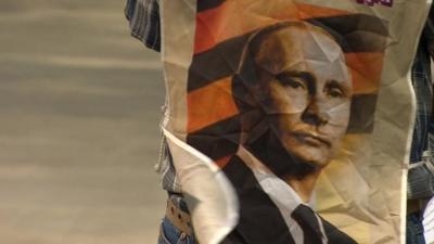 Image of Putin worn at a protest