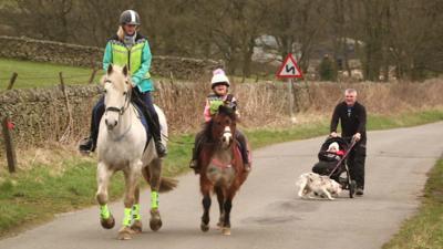 family on horses