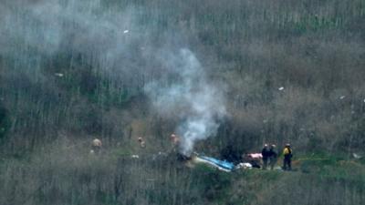 Officers inspect Kobe Bryant helicopter crash site