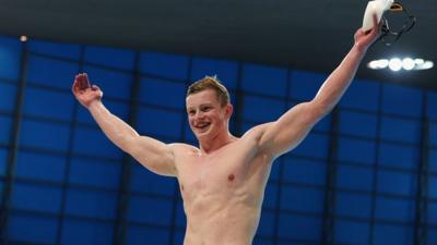 Adam Peaty celebrating