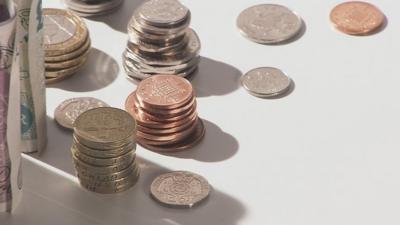 Coins and notes piled up