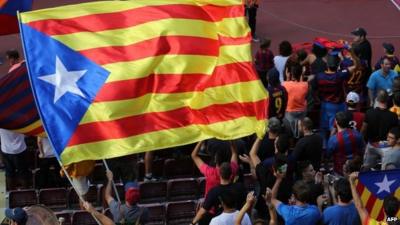 Barcelona's supporters wave a pro-independence Catalonia flag