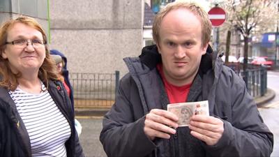 Man holding cash