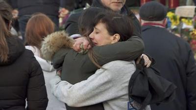 Two women hug