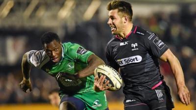 Ospreys scrum-half Rhys Webb scores his side's third try chased by Connacht's Niyi Adeolokun