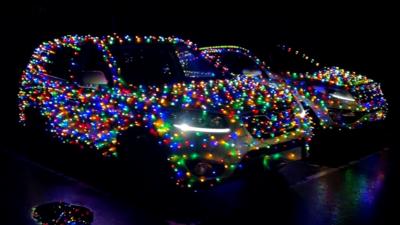 Car covered in Christmas lights