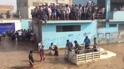 People attempt rescue in floodwaters