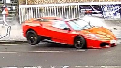 CCTV footage shows the sports car bouncing off the bike racks and mounting the opposite pavement.