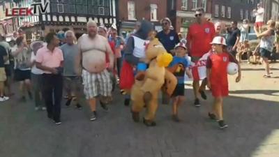 England fans gather in Leek to sing football song Vindaloo