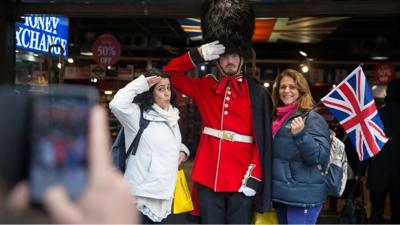 Tourists with a London guard