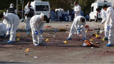 Forensic teams of the police investigate the area after multiple explosions ahead of a rally in Ankara, Turkey