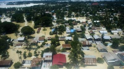 Houses surrounded by flood water