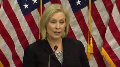 Senator Gillibrand speaks at podium