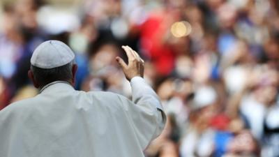 Pope waves to crowds