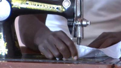 A former Boko Haram fighter sewing