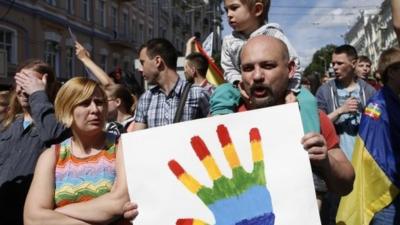 Ukrainian gay rights activists take part in a march in Kiev, Ukraine, Sunday, June 12, 2016