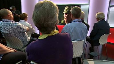 Relatives of bomb victims listening to Michael Hayes