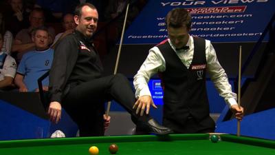 Mark Williams and Michael Holt share a joke after a surprising bounce at the World Snooker Championship