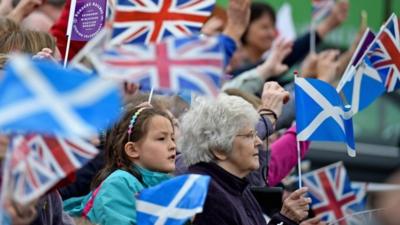 People with flags in Newtongrange