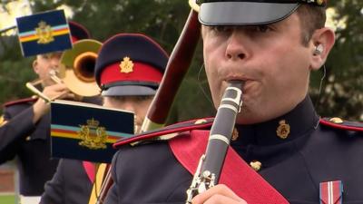 The band has to stay two metres apart behind screens as their traditional festive concert moves online.