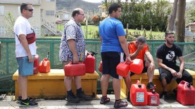 People queue in Albonito