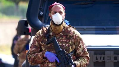 Army officer wearing a mask