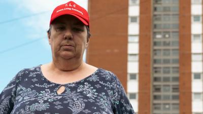 Carol stood outside Parkway Towers in Leeds