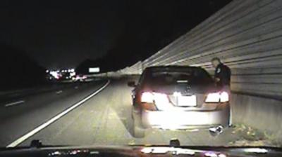 A police officer at a traffic stop.