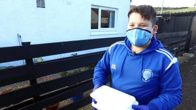 Keegan, 15, spends his Friday afternoons delivering fish and chips to the people of Golspie.