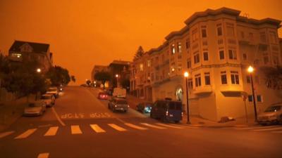 A San Francisco street with an orange sky