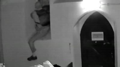 A man breaking into a church