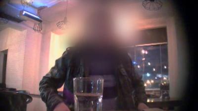 A man with a blurred face to hide his identity