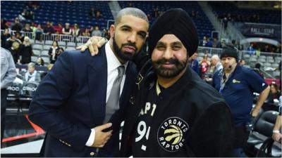 Drake and Nav Bhatia ata Toronto Raptor game.