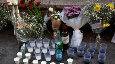 Flowers and tributes on the pavement in Seoul