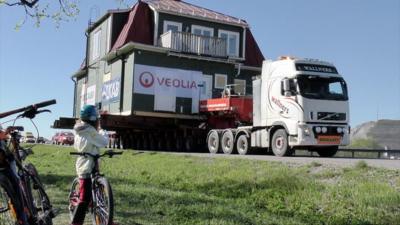 A house being transported by lorry in Kiruna