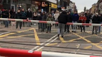 Man at level crossing