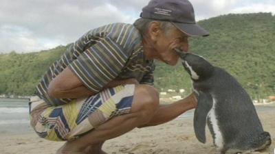 Joao Pereira de Souza with penguin