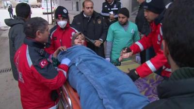 Wounded woman on a stretcher