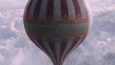 Hot-air balloon in a cloudy sky
