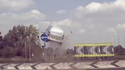 Van 'flies' in roundabout crash