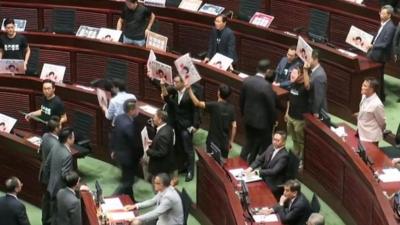 HK lawmakers disrupting parliament