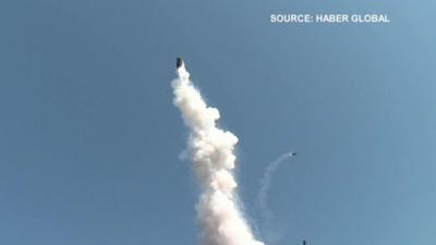 Tank being launched in the air following an explosion