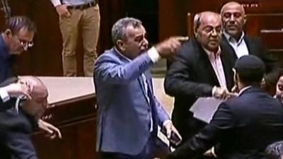 Israeli Arab MPs shout and rip up the bill after Knesset vote on nation state bill