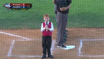 Boy singing national anthem