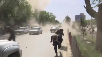 People flee the site of the bombings