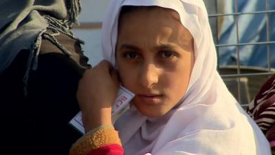 Girl waiting in line at Dibaga camp