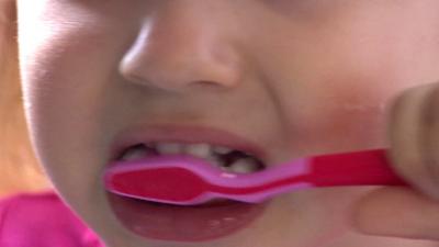 Child brushing teeth